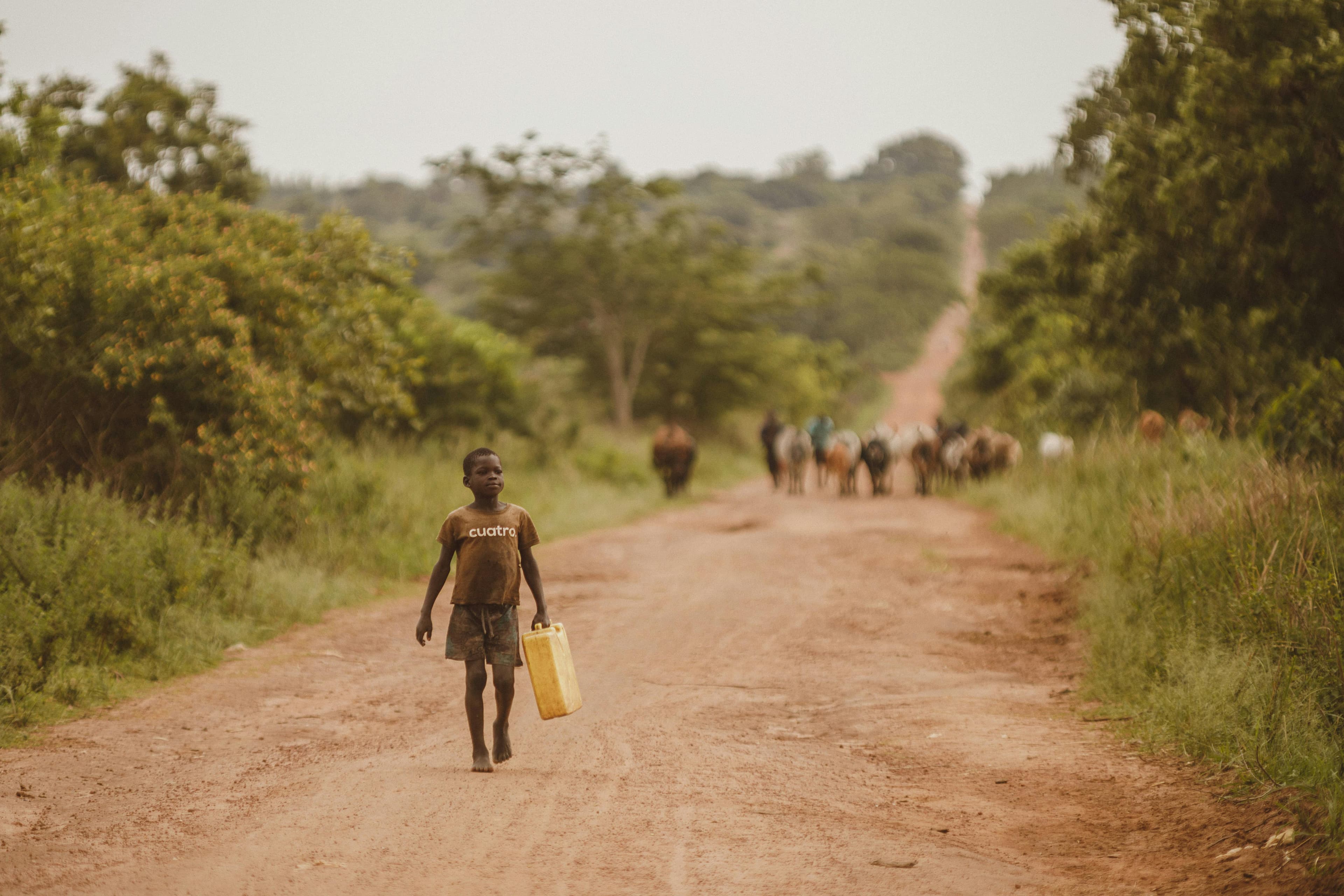 a child giong to fetch water